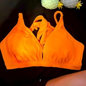 The brand is target the size a medium, and the colors, orange